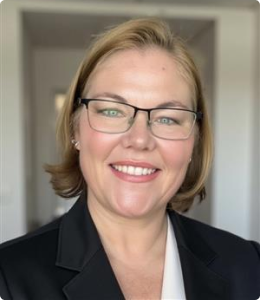 woman with short blonde hair and thin frame glasses